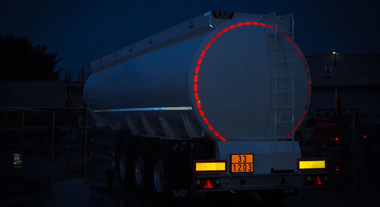Tanker trailer featuring reflective safety tape and high-visibility reflective markings designed to improve visibility in low-light and nighttime driving conditions.