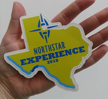 Bright and durable vinyl decal shaped like Texas, designed to highlight local events or experiences with custom graphics.
