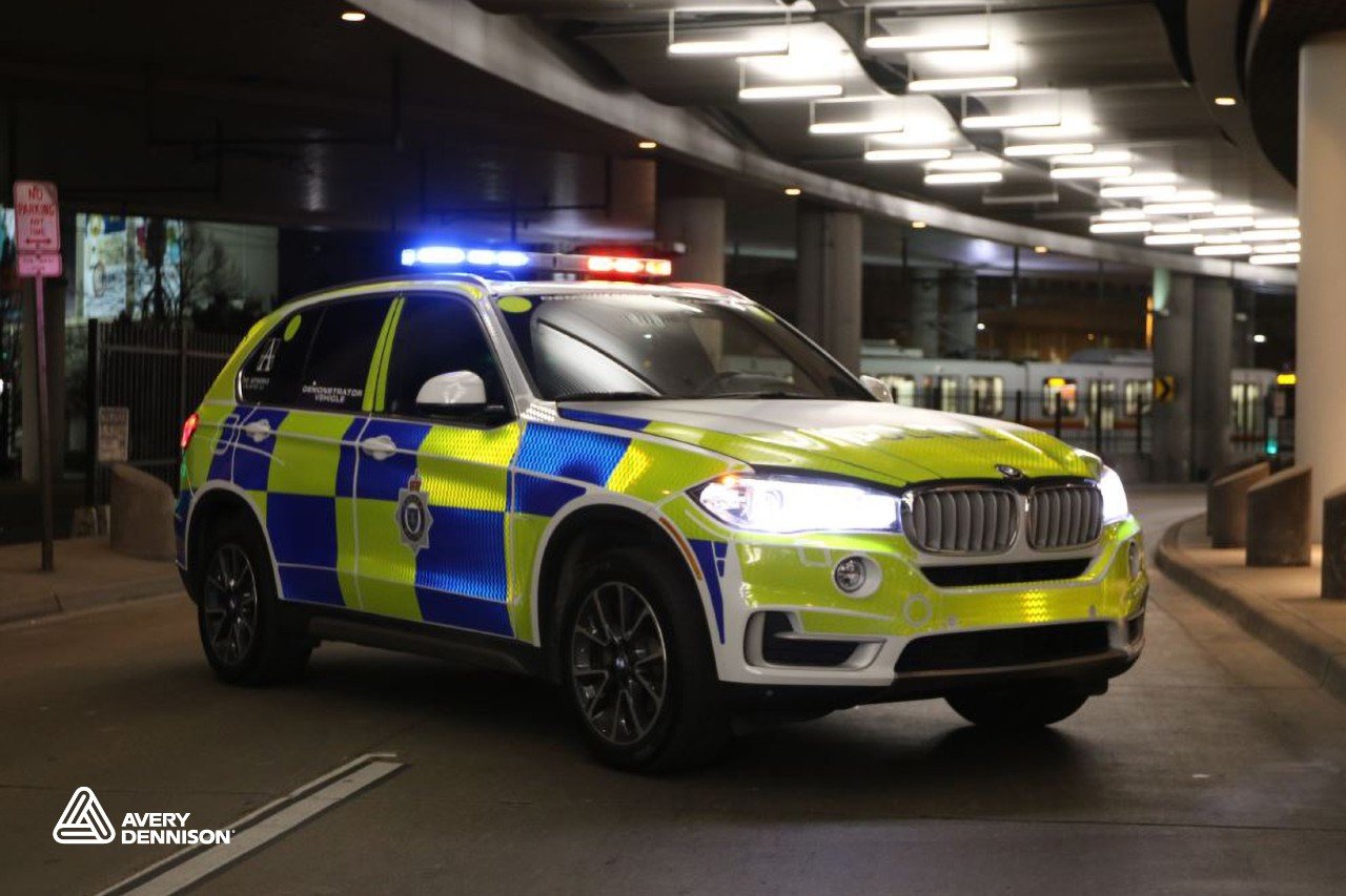 Police SUV featuring reflective vehicle wrap graphics designed for maximum visibility in low-light and nighttime conditions. 